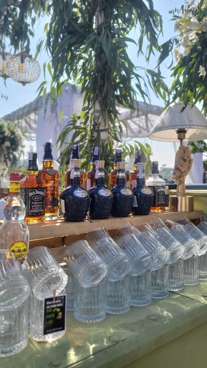 Professional bartender crafting a cocktail at a stylish bar during a wedding