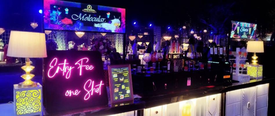 Elegant bar setup with a variety of drinks and glassware, perfect for any event.