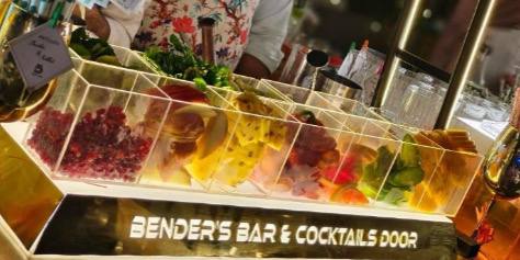 Professional bartender crafting a cocktail at a stylish bar during a wedding
