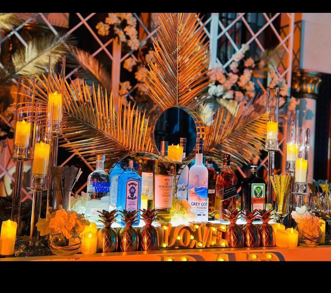 Professional bartender crafting a cocktail at a stylish bar during a wedding